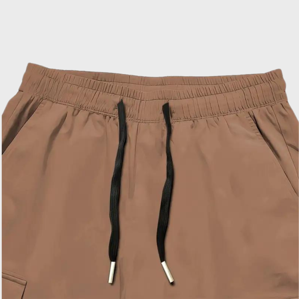 Durable men's relaxed fit cargo trousers, comfy drawstring waist, spacious pockets; versatile casual pants.