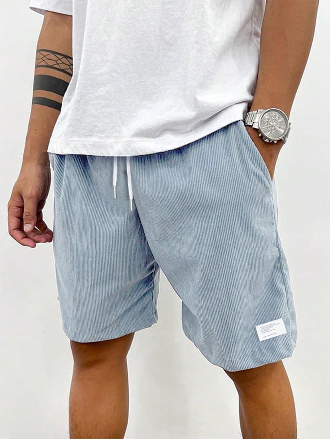 Front view of men's white casual drawstring shorts, essential for beach and summer fashion.