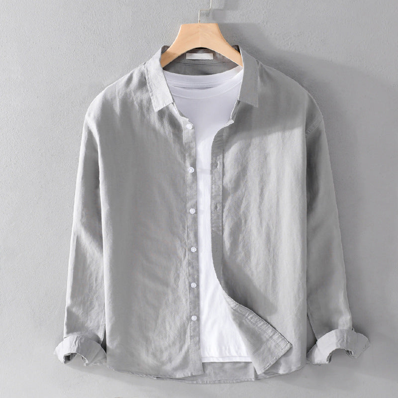 Model wearing a men's casual relaxed fit shirt, long sleeve, for stylish and comfortable menswear.
