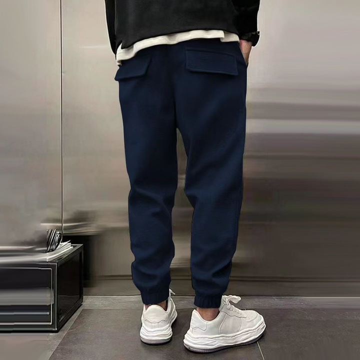 Collection of men's relaxed fit casual trousers in various colors, comfortable and fashionable apparel