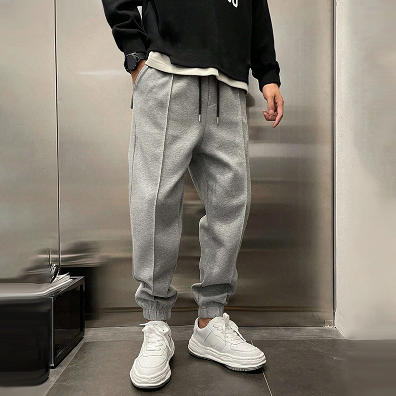 Stylish men's relaxed fit casual trousers in navy, side view, versatile for everyday wear