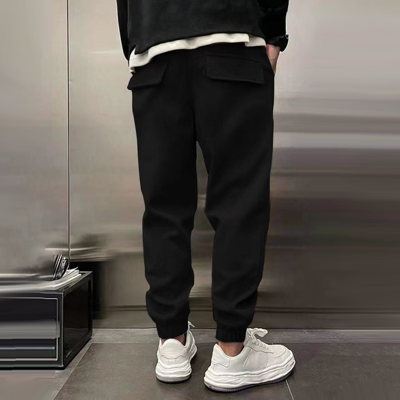 Back view of men's relaxed fit casual trousers with pockets, emphasizing comfortable design