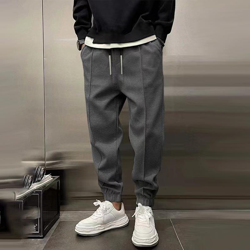 Detail shot of the waistband and drawstring on men's relaxed fit casual trousers for a perfect fit