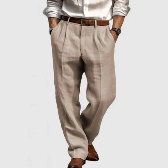 Close-up of the breathable cotton linen fabric of men's casual light grey trousers.