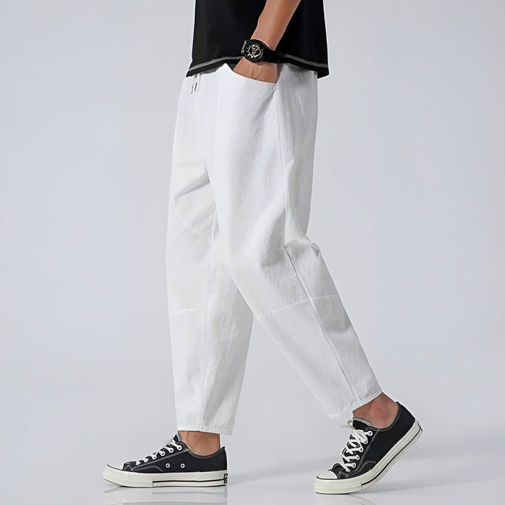 Ultra-comfortable men's relaxed fit cropped chinos, modern style for everyday wear.