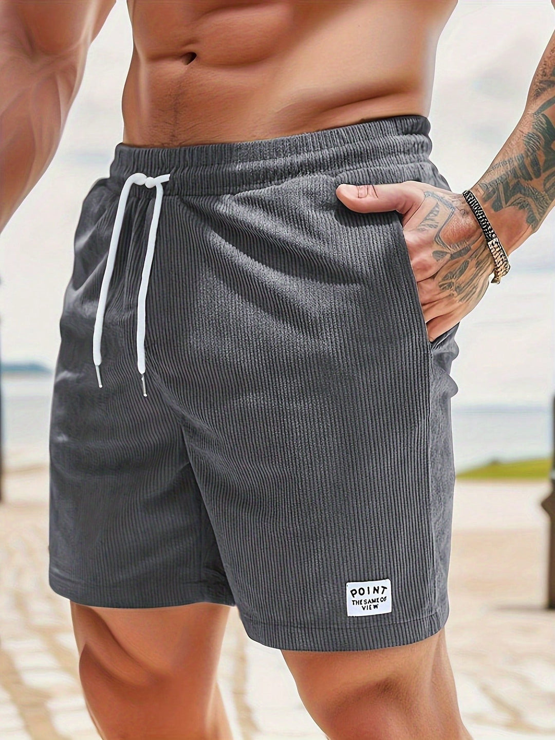 Men's casual drawstring shorts paired with a simple t-shirt, demonstrating an easy, relaxed summer outfit.