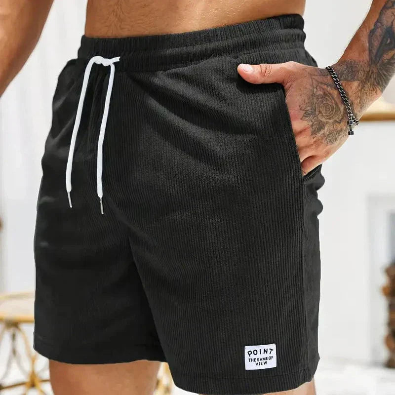 Relaxed fit men's casual shorts with a drawstring waist, comfortable and fashionable.