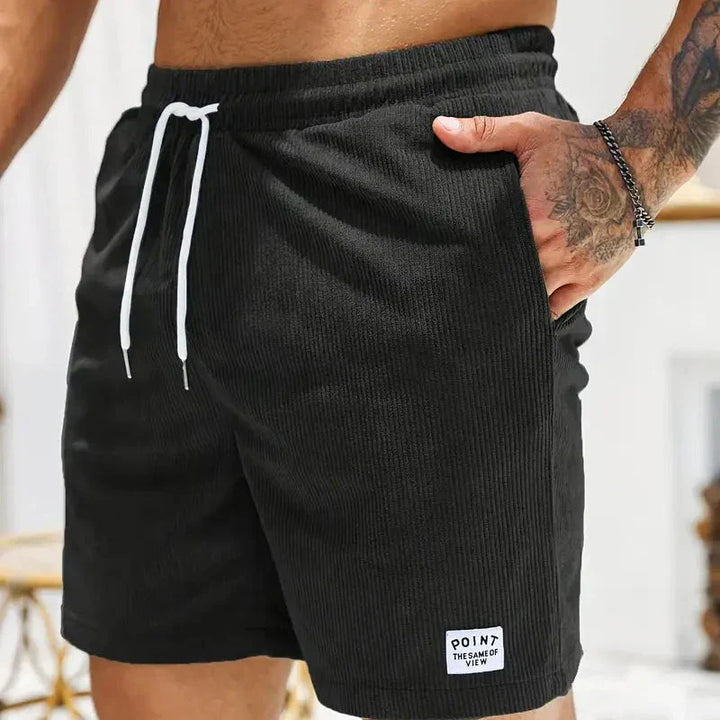 Relaxed fit men's casual shorts with a drawstring waist, comfortable and fashionable.
