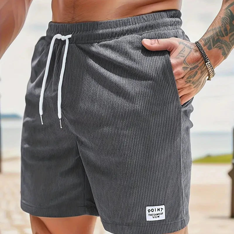 Men's summer casual shorts, relaxed fit drawstring design with unique patch detail.