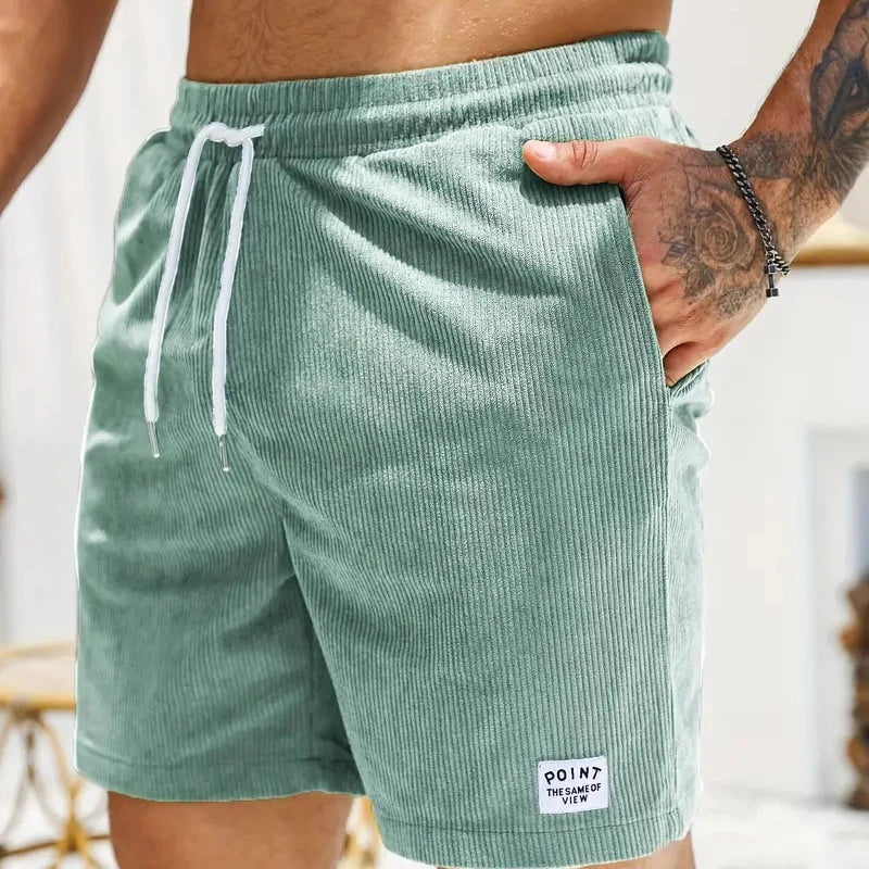 Relaxed fit men's shorts with adjustable drawstring closure, great for casual wear.