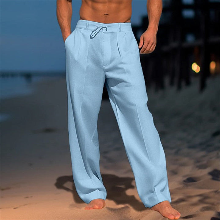 Full shot of men's relaxed fit drawstring pants in a neutral color, versatile casual apparel.