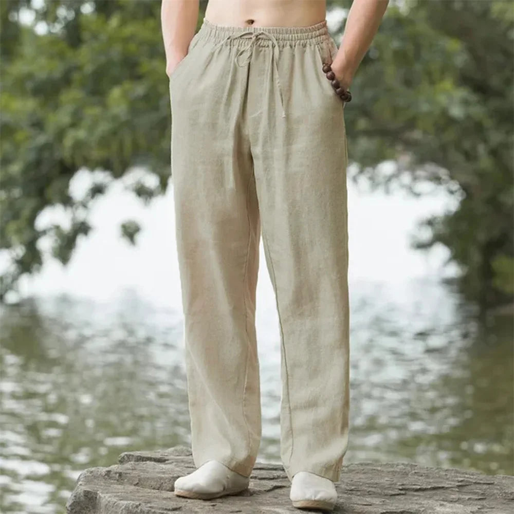 Black relaxed fit linen blend travel pants for men, featuring a comfortable drawstring