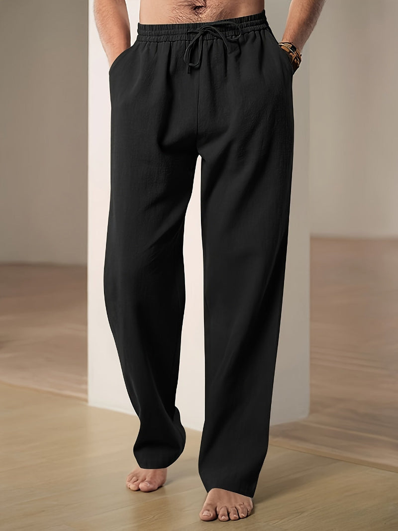 Casual men's linen blend pants with adjustable drawstring waist, offering a relaxed fit for travel.