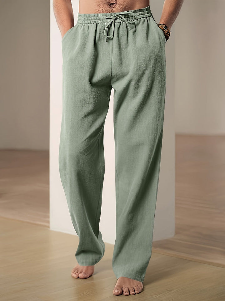 Close-up of the textured linen blend fabric and adjustable drawstring on men's casual pants.