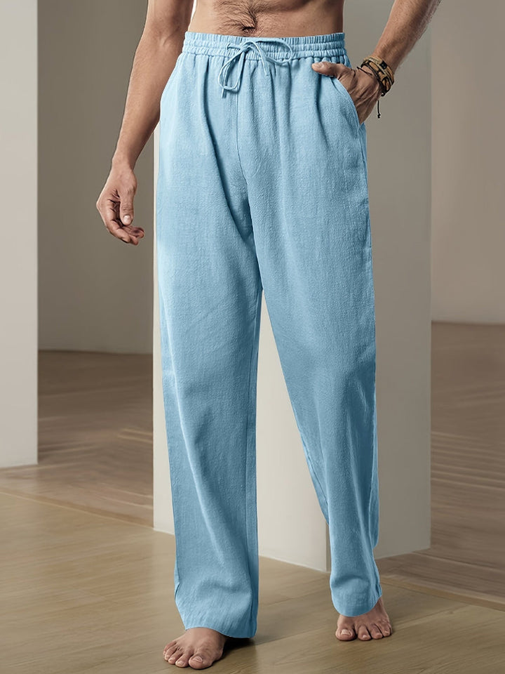 Comfortable men's drawstring linen blend trousers with a relaxed fit, suitable for various casual occasions.