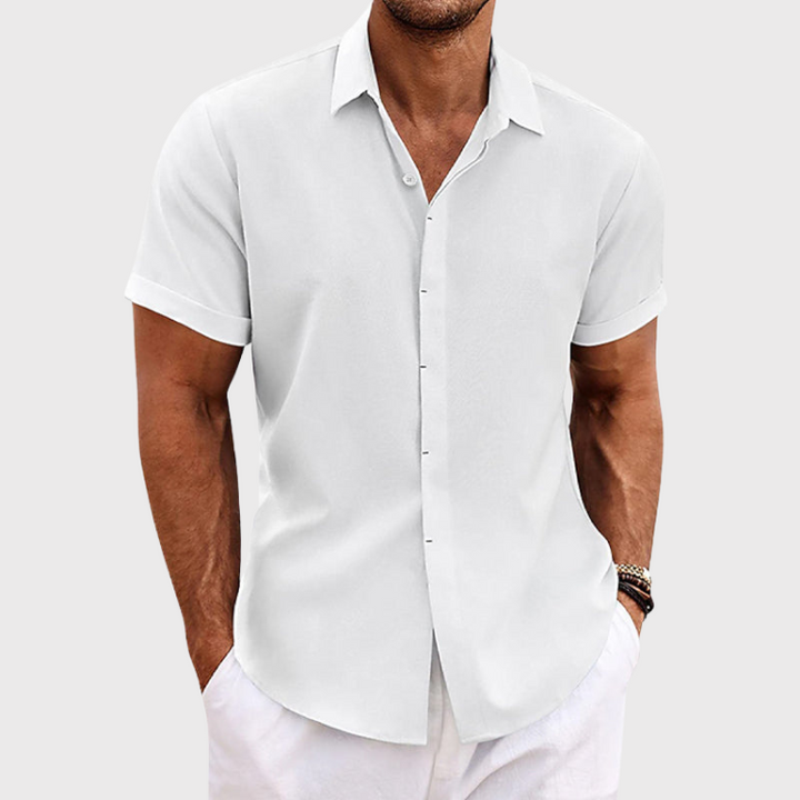 Stylish men's short sleeve linen shirt, perfect for summer vacations, offering comfort and a relaxed fit.