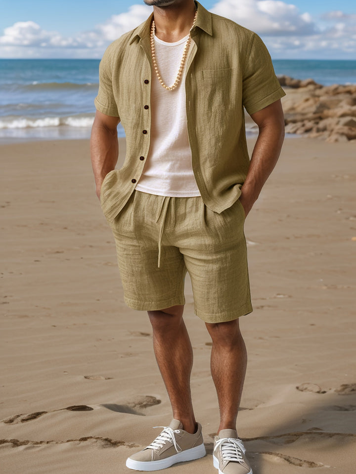 Casual men's two-piece summer outfit: breathable linen shirt & matching shorts for warm weather comfort.