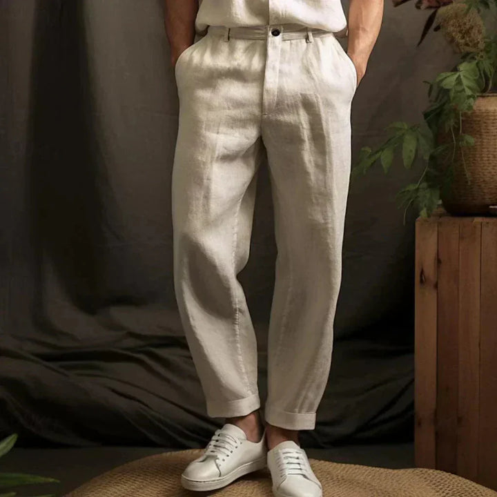 Men's relaxed fit linen trousers in a light color, perfect for airy summer casual and beachwear.