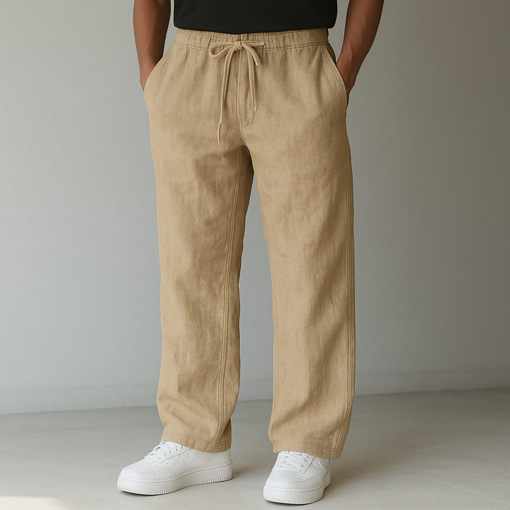 Smart casual men's drawstring linen trousers, relaxed fit. Ideal for warm weather comfort and style.