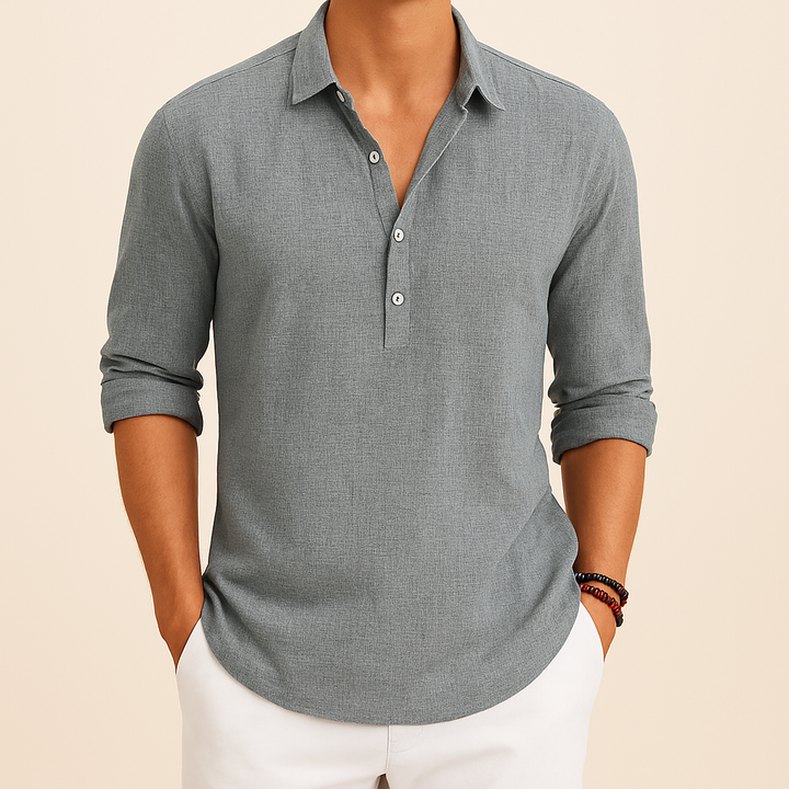 Close-up of the button neck on a men's relaxed fit long sleeve polo shirt. Smart casual men's fashion top.