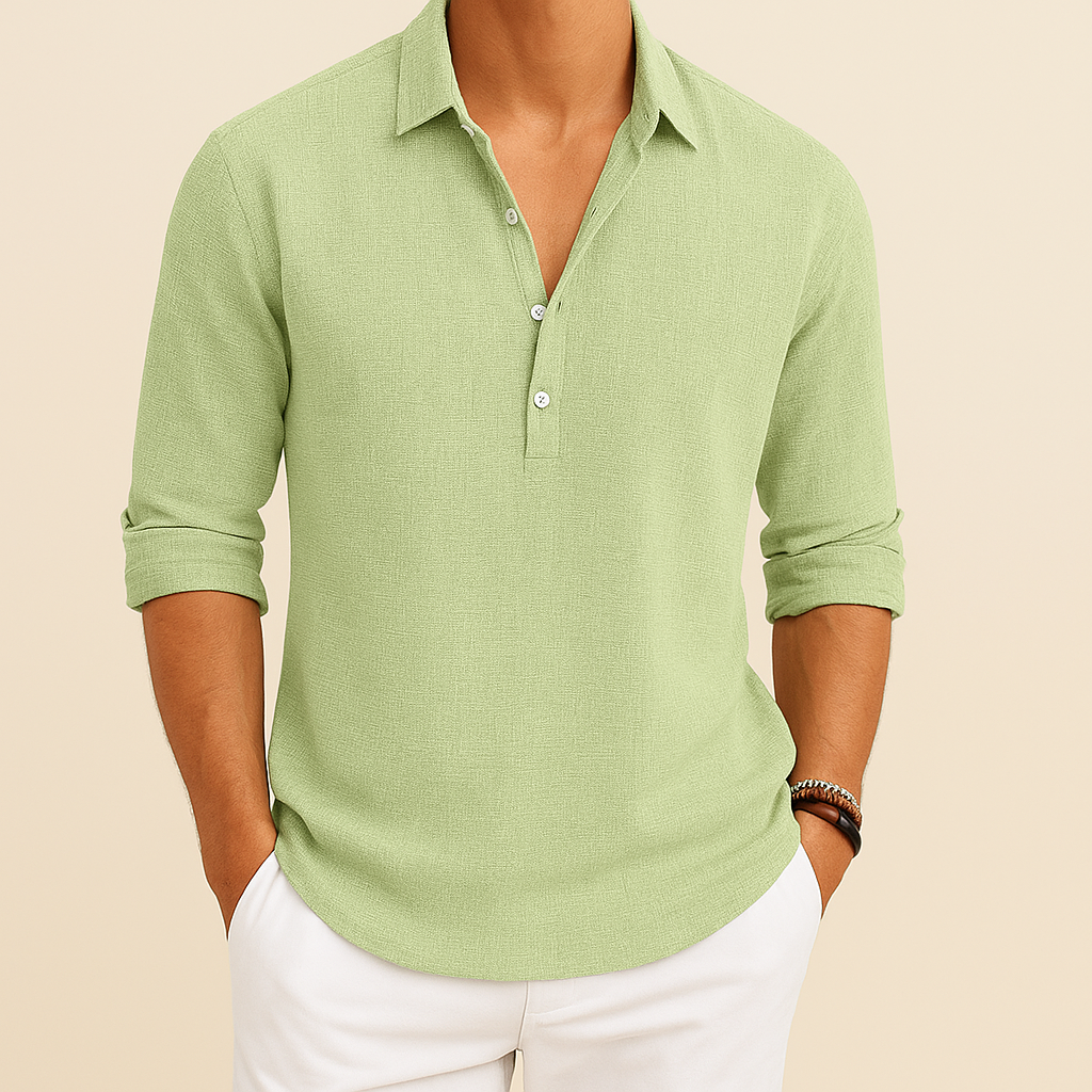 Side view of a man wearing a relaxed fit long sleeve polo shirt with a button neck. Modern men's casual wear.