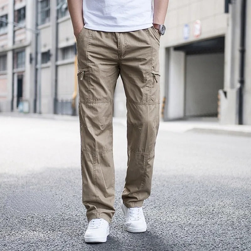 Men's relaxed fit organic cotton cargo pants in khaki, side view, multiple pockets