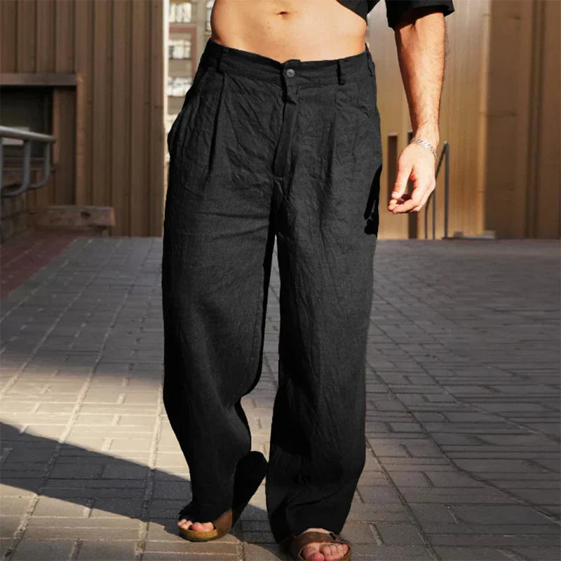 Comfortable men's clothing: relaxed fit pleated linen trousers in a neutral shade.