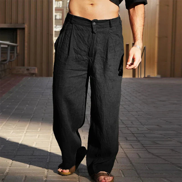 Comfortable men's clothing: relaxed fit pleated linen trousers in a neutral shade.