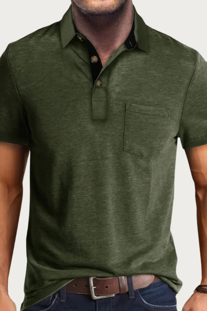 Relaxed fit men's polo, short sleeve, with a distinctive contrast collar. Features a button placket & a handy chest pocket.
