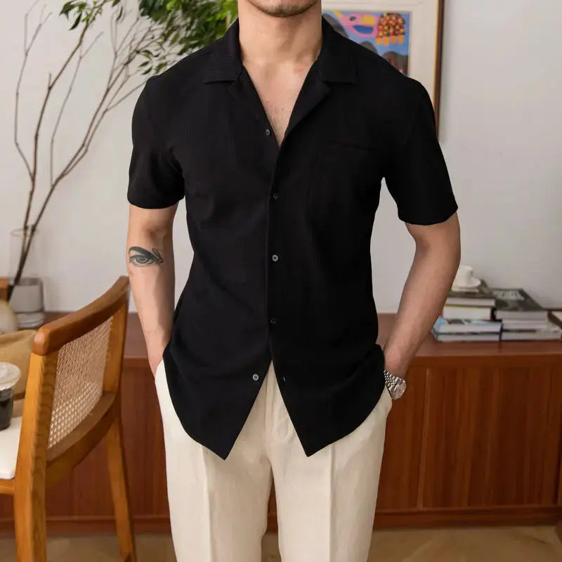 Men's relaxed fit textured short sleeve shirt with open collar. Ideal for casual summer fashion.