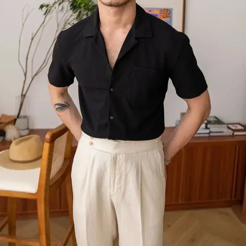 Modern men's casual button shirt, relaxed fit, textured fabric, short sleeve, open collar. Versatile menswear.