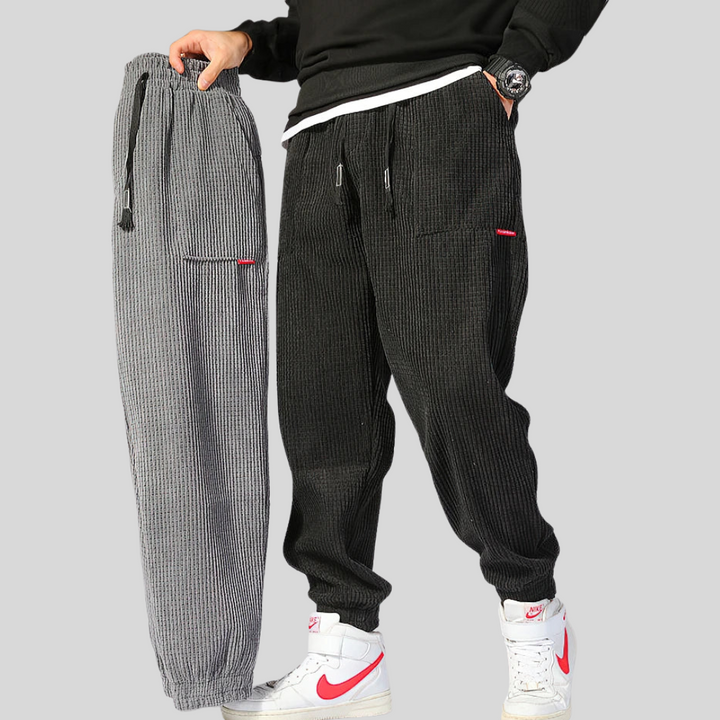 Casual men's wide leg corduroy joggers in black, designed for ultimate comfort.