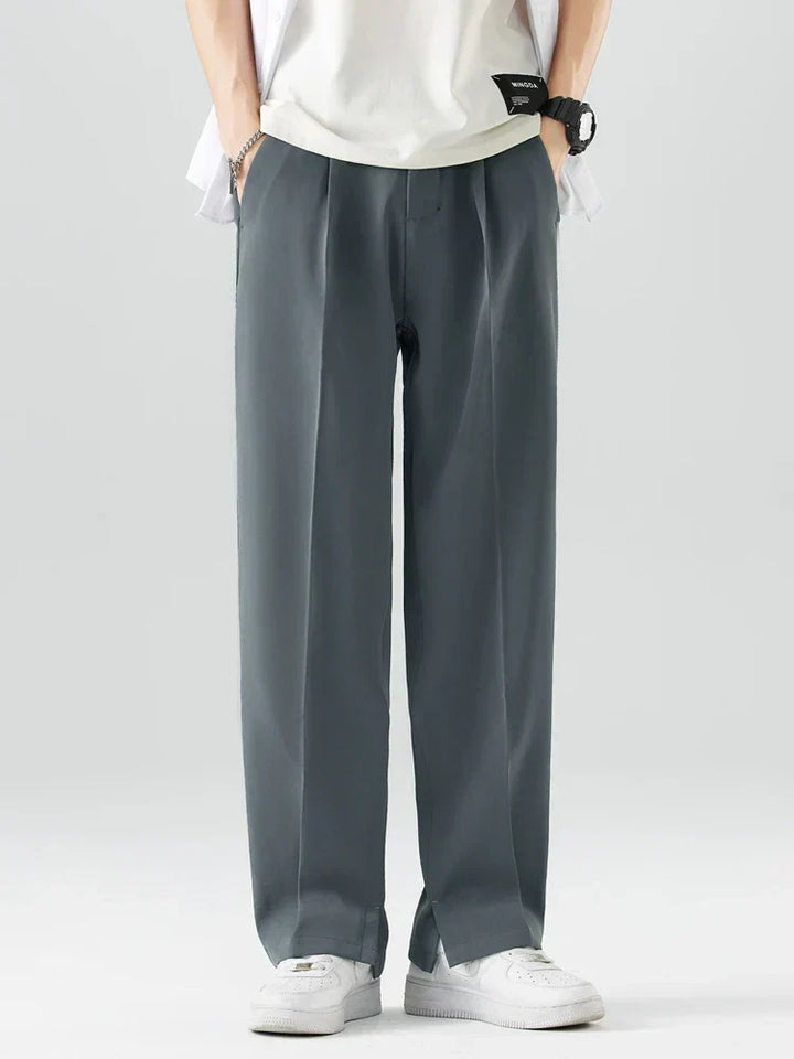 Close-up of fabric detail on men's wide leg relaxed fit trousers, showing quality