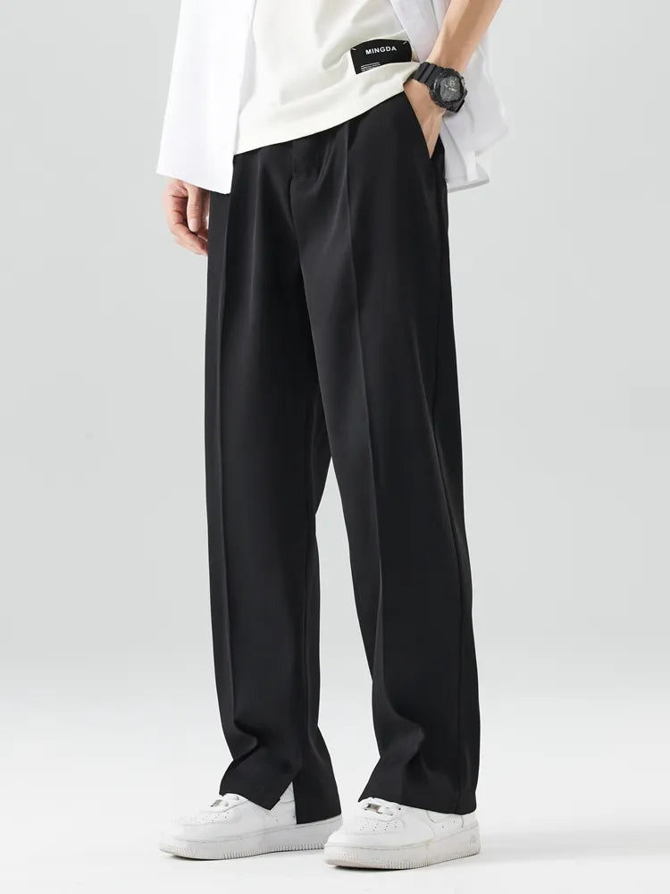 Full-length view of men's wide leg relaxed fit trousers, demonstrating a modern silhouette