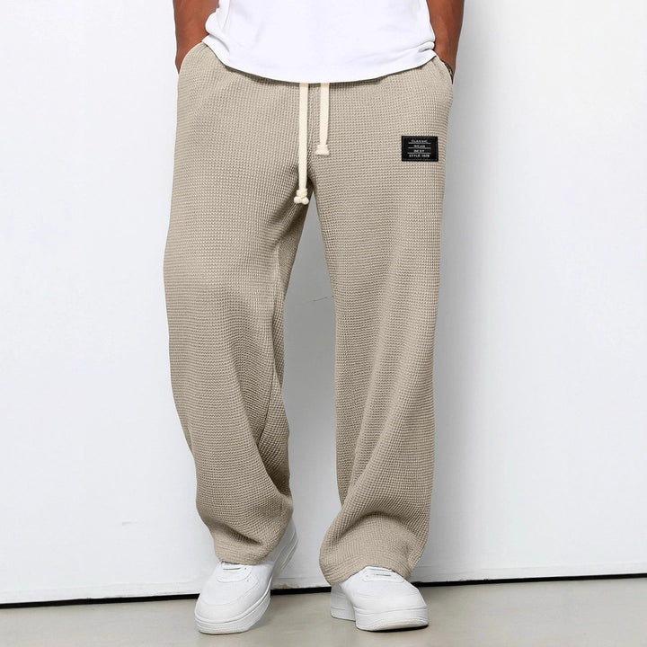 Full-body shot of men wearing comfortable wide leg sweatpants, suitable for winter