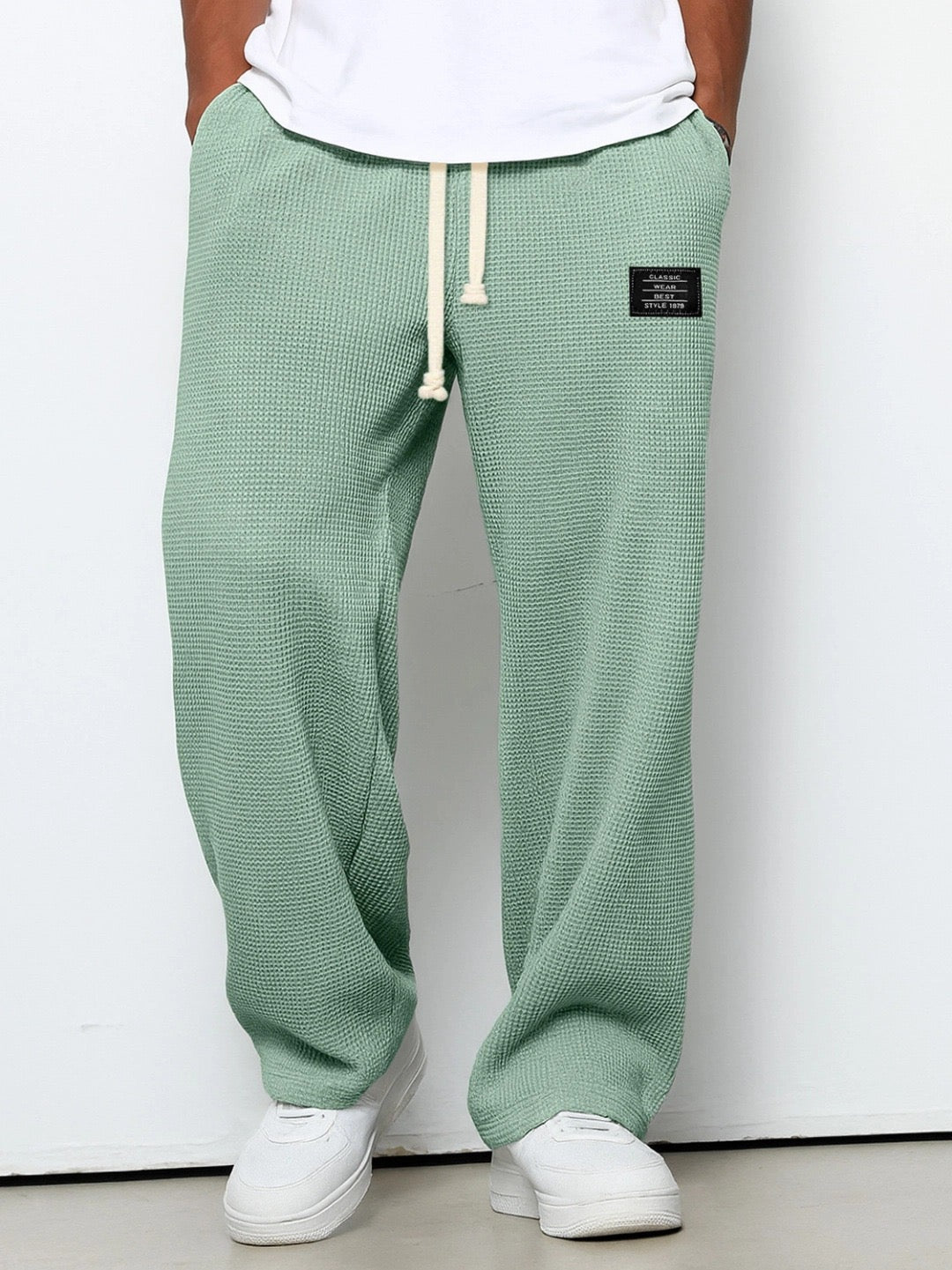Side view of men's wide leg sweatpants, showcasing relaxed fit and soft material