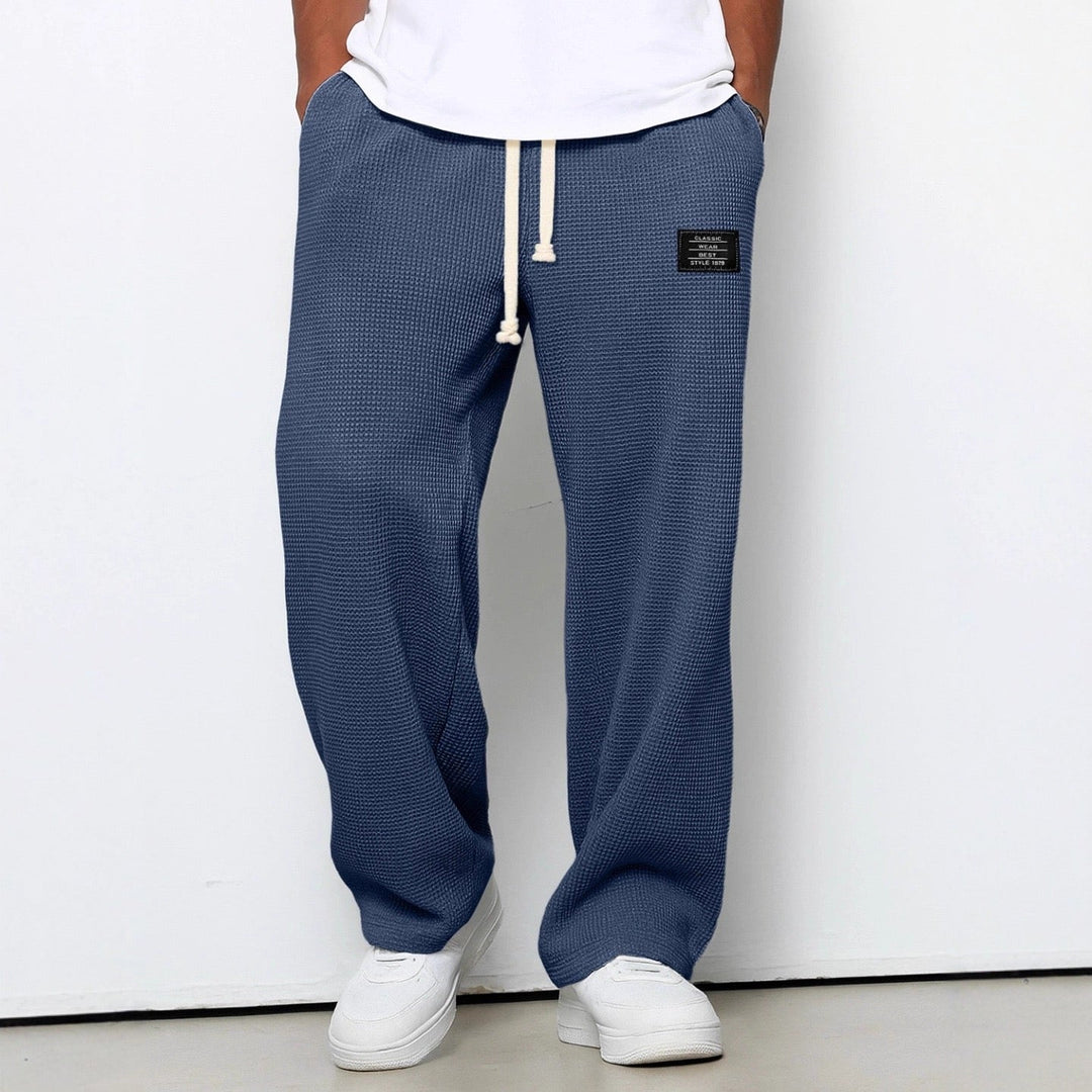 Textured detail of the breathable fabric on men's casual wide leg sweatpants