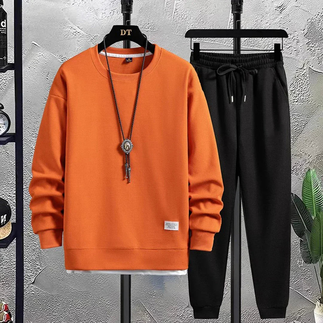 Comfortable men's loungewear tracksuit. Relaxed fit pullover set with joggers for ultimate style & ease.