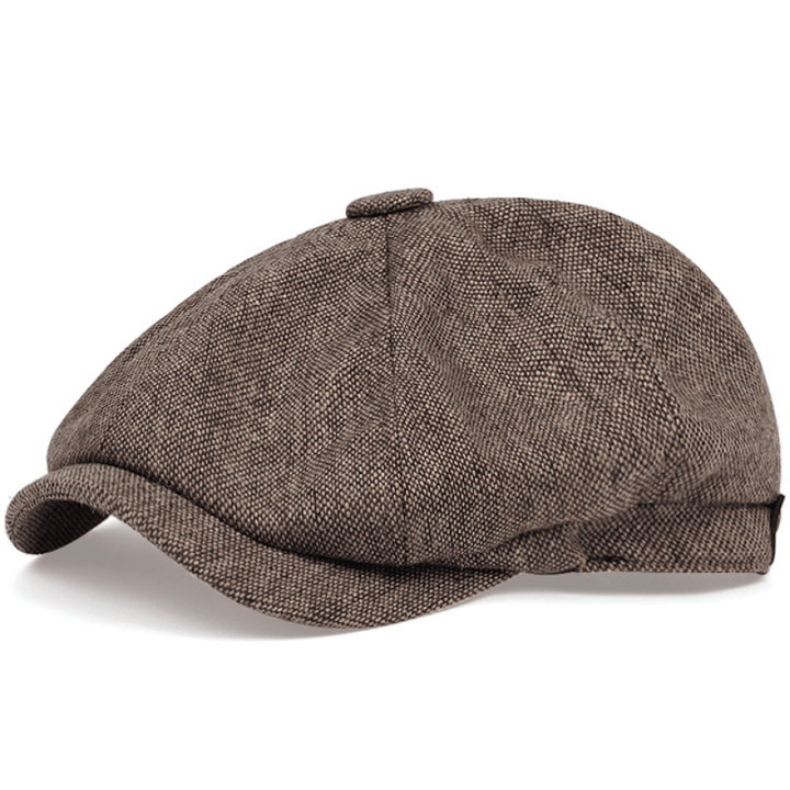 Gatsby style men's flat cap, herringbone pattern, retro fashion headwear.