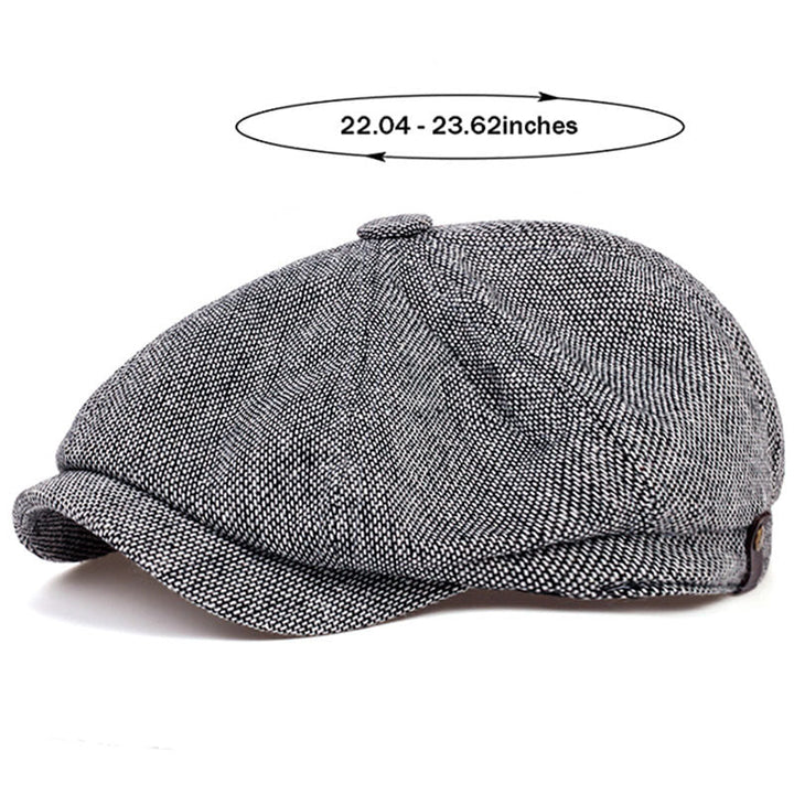 Close-up of men's retro flat cap showing detailed herringbone pattern, vintage.