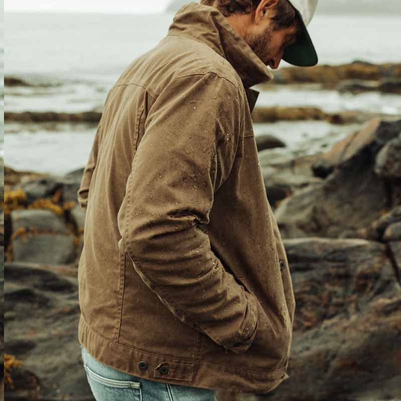 Practical men's autumn utility jacket in rugged brown. Versatile outerwear for fall adventures & winter.