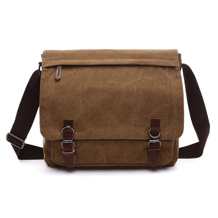 Unisex rugged canvas messenger bag, perfect for daily carry, showcasing its spacious main compartment