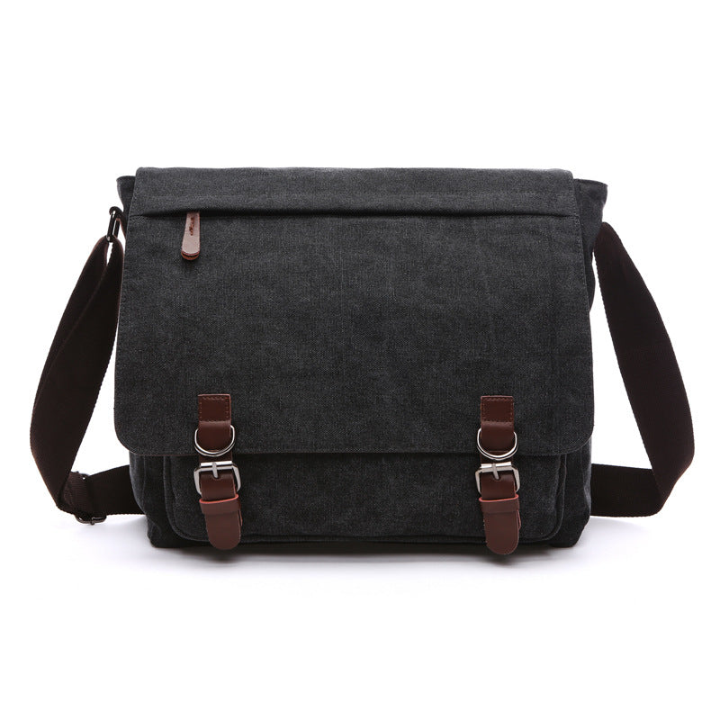Stylish dark canvas shoulder bag for men, featuring a rugged design and versatile messenger style