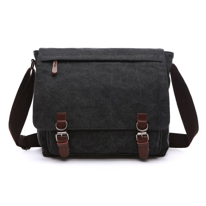 Stylish dark canvas shoulder bag for men, featuring a rugged design and versatile messenger style