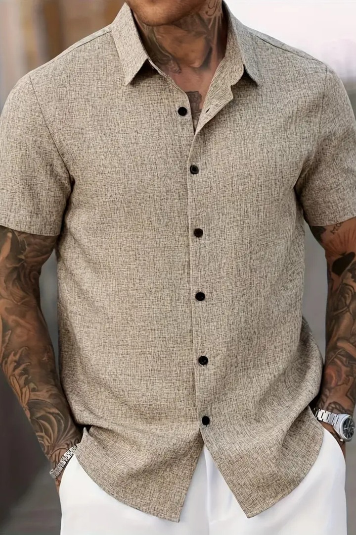Men's smart casual short sleeve button down shirt. Versatile for warm weather occasions.
