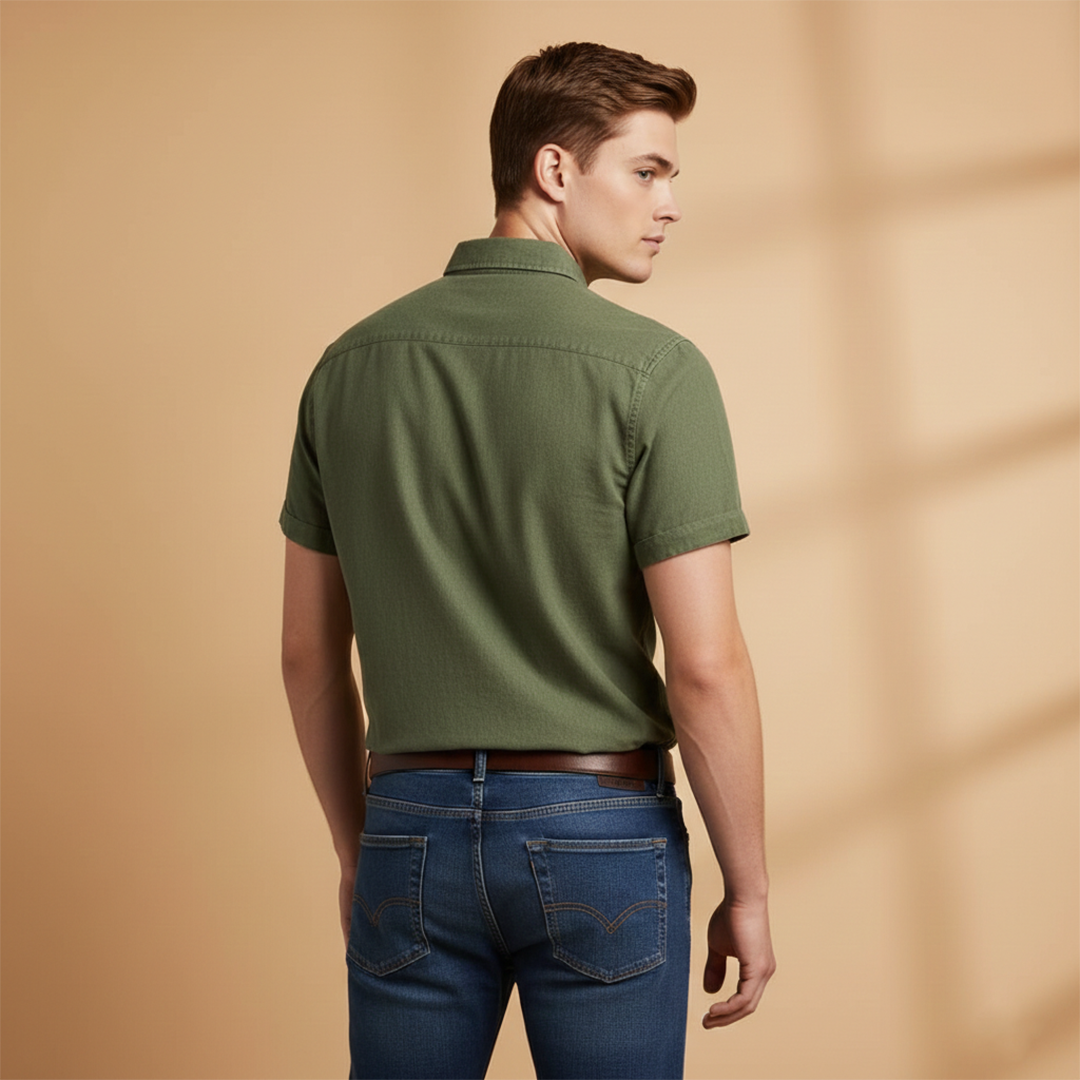 Trendy men's button-up shirt, short sleeves, & chest pocket for a smart casual spring look.