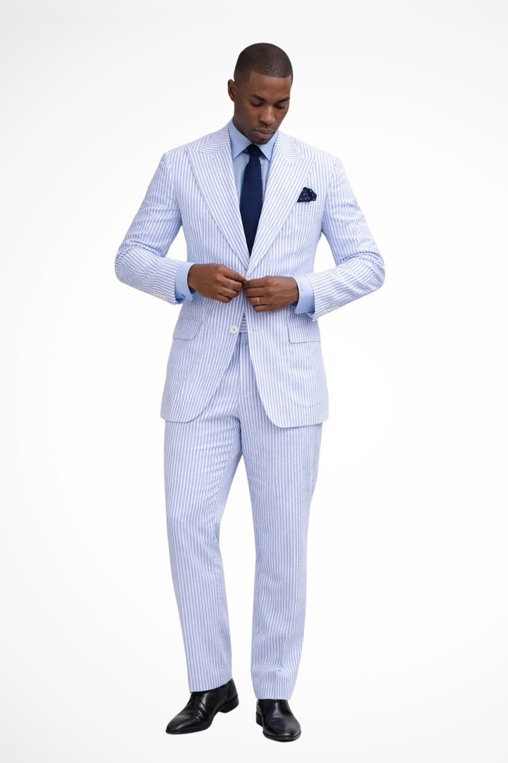 Men's sky blue striped peaked lapel suit, perfect tailored formal wear for a summer wedding guest.