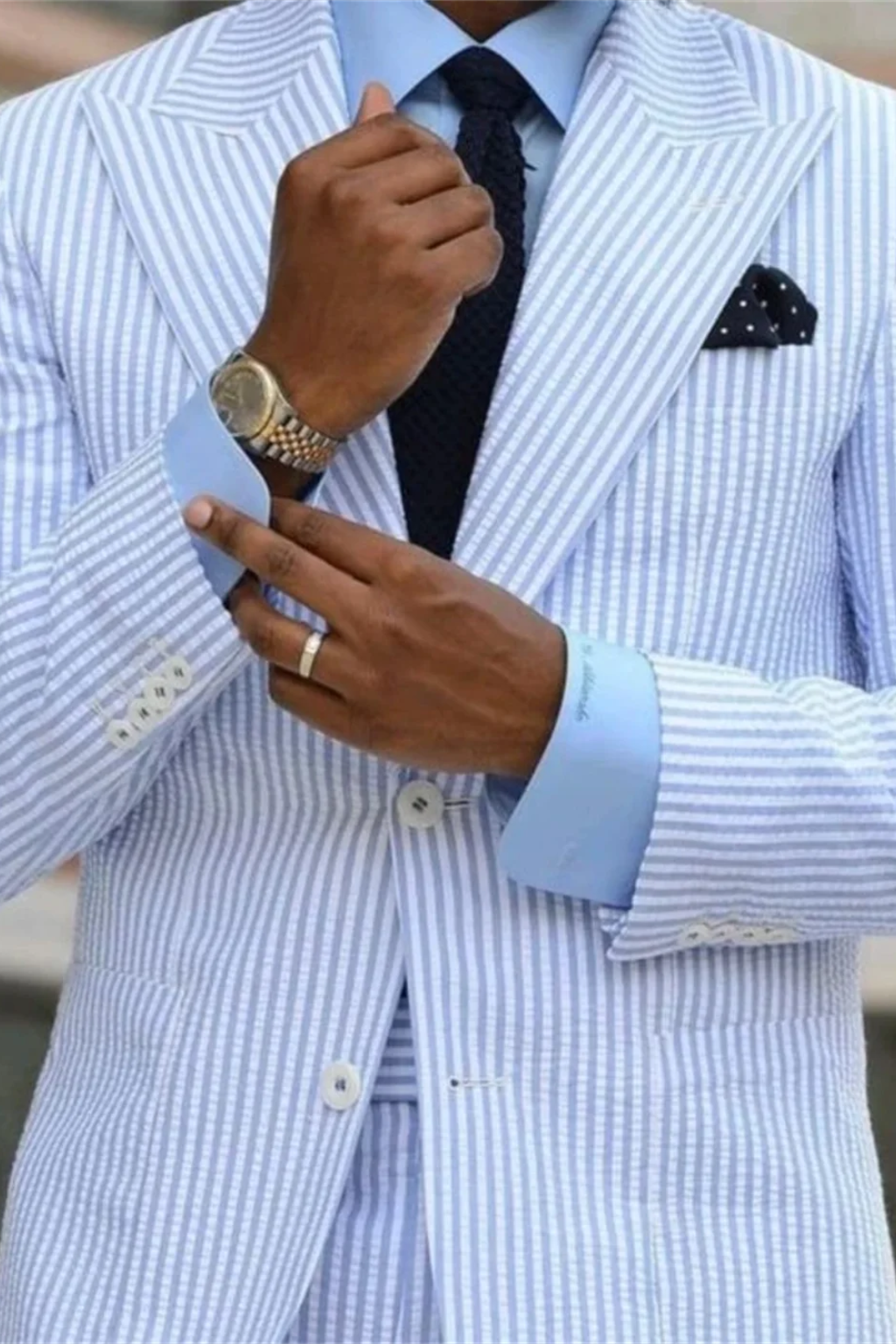 Stylish men's two-piece striped summer suit with peaked lapels, ideal formal occasion wear for weddings.