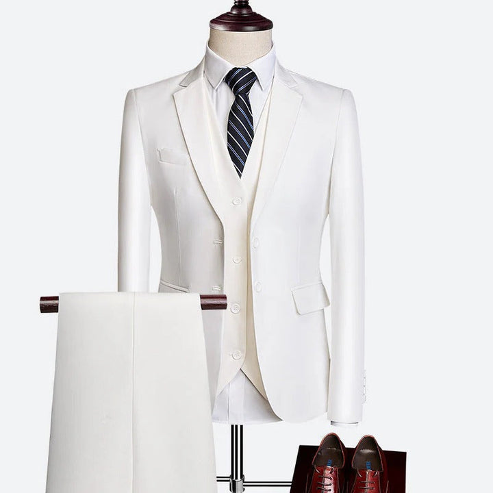 Navy blue men's 3-piece suit with waistcoat, a smart casual or formal spring outfit.