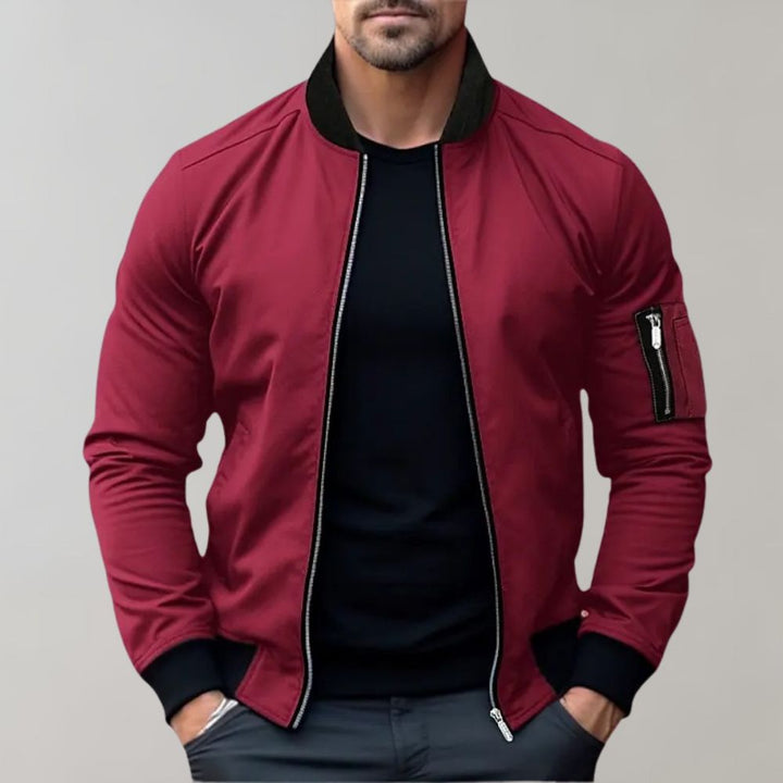 Casual men's outerwear: a sleek slim fit bomber jacket with a full zipper and practical pockets.